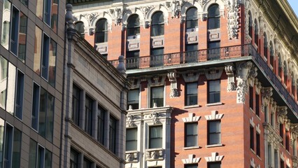 Fototapeta premium New York City Midtown urban buildings architecture, Manhattan street or avenue, United States of America. Red brick classic house, USA. Typical old historic real estate property in NYC.