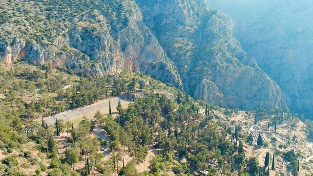 Delphi, Greece. Ruins of the ancient city of Delphi. Sunny weather in the morning, Summer. Drone footage