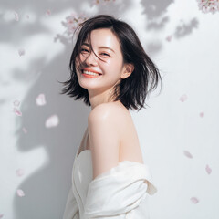 美しい肌の女性と桜が舞う春の背景