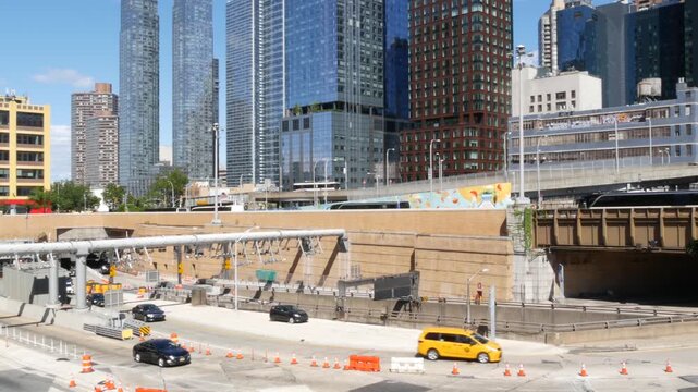 Traffic in Manhattan Midtown, Hells Kitchen New York City, United States of America. Lincoln Tunnel highway junction near Port Authority bus terminal. Toll road transport, cars in residential district