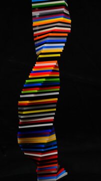 Colorful spiral shape with gradient colors made of Cast Acrylic Sheet - Plexiglas creating vibrant abstract DNA pattern and mesmerizing abstract on dark background