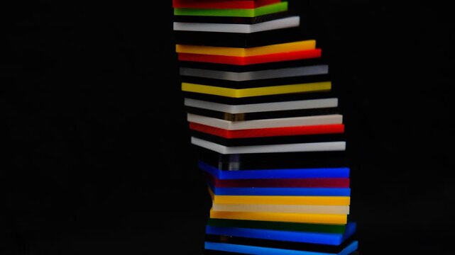 Colorful spiral shape with gradient colors made of Cast Acrylic Sheet - Plexiglas creating vibrant abstract DNA pattern and mesmerizing abstract on dark background