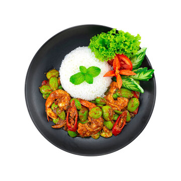 Stir fried stink bean (bitter bean) with shrimps and shrimp paste serving rice recipe (goong pad kapi sator) thai food spicy curry dish topview