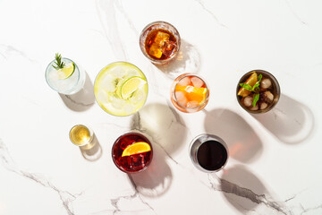 Alcohol cocktail drinks at white background.