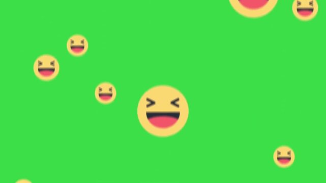 Laughing emoji icons floating up on green screen background for video production