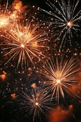 Fototapeta premium Bright and colorful fireworks explode in the night sky, creating a stunning visual spectacle.