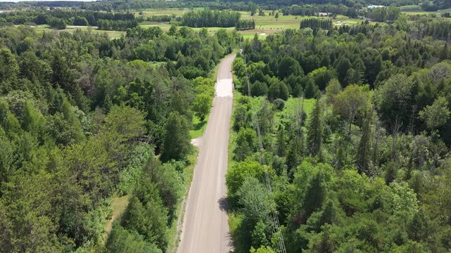 Rising Aerial Shot Of Natural Forest And TPC Toronto Osprey Valley Golf Course In Alton, Caledon, Canada.