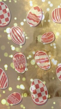 Vertical video: Tilting cam making parallax, revealing golden cat blinking behind egg decals, bokeh