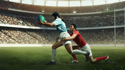 Fototapeta premium Female rugby player scoring try while opponent tackles from behind. Concept of perseverance, competitive spirit, women sport equality, teamwork and high performance under pressure.