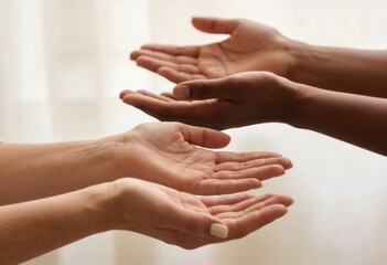Close up of diverse female hands with open palms. Give To Gain concept for International Womens Day 2026