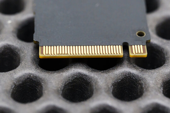 Close view of SDD component on black surface with patterns