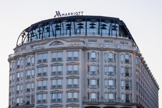 low angle view of the elegant marriott hotel building featuring classic architectural details, a glass rooftop dome, and a clear sky, located in skopje city