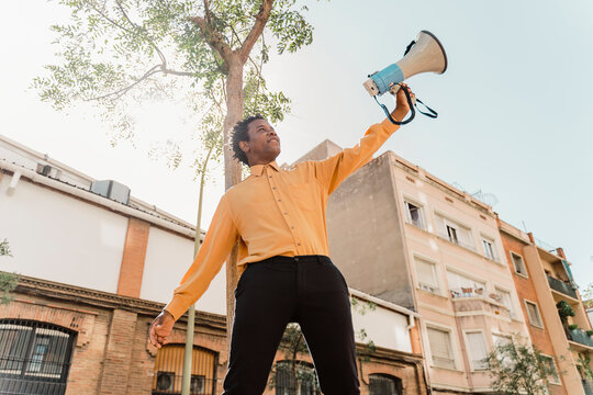 Mature man using megaphone and screaming