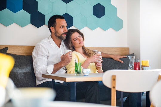 Couple in love drinking coffee in a cafe