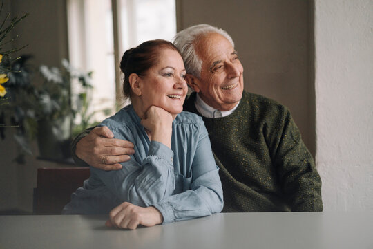Portrait of happy senior couple at home