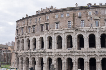 Fototapeta premium Historic Teatro di Marcello in Rome featuring ancient stone arches and classical Roman architecture landmark.