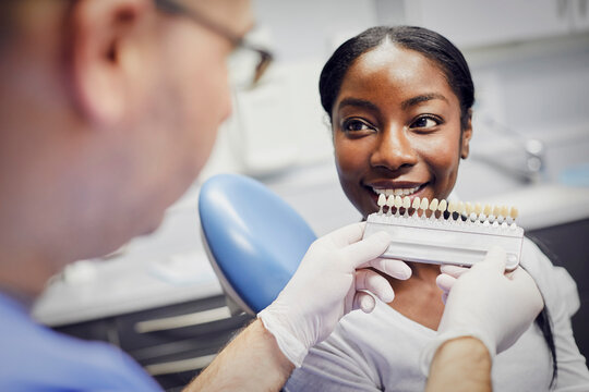 Patient getting dental teeth whitening treatment