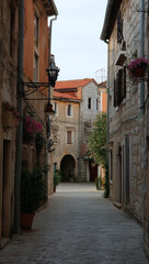 Fototapeta premium Narrow cobblestone street with ancient stone houses in Old Town