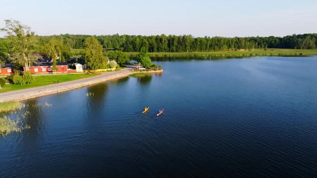 Aerial view of sunset light kayaking tranquil waters in the Finnish Archipelago