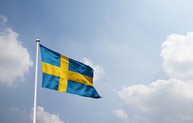 Sweden national flag waving in sky.