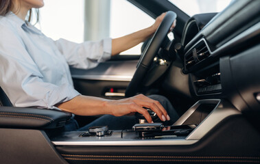 Detailed close up view of woman that is driving the new car