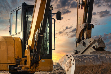 Excavator silhouetted against a colorful sunset sky. Heavy construction machinery at a worksite during golden hour, dramatic evening light, industry and engineering concept. © jarizPJ