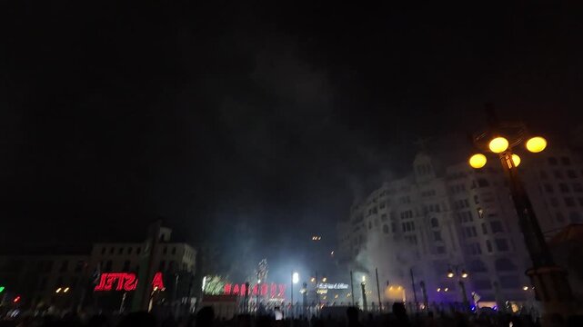 Night fireworks light up Valencia's Plaza del Ayuntamiento during the Las Fallas festival in Spain
