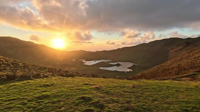 Golden sunset over a Caldera of Corvo Island, a volcanic crater with lagoons reflecting the sky, Azores, Portugal