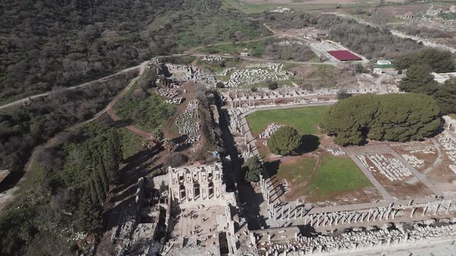 Aerial drone shot of the ancient city of Ephesus, the library of Celsus and the ancient Roman theater on a sunny day. High quality 4k footage