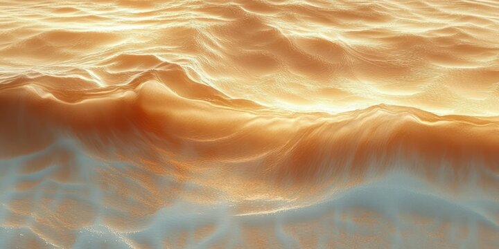 Serene sunlit golden rippling dunes and smooth waves with warm shimmering glow
