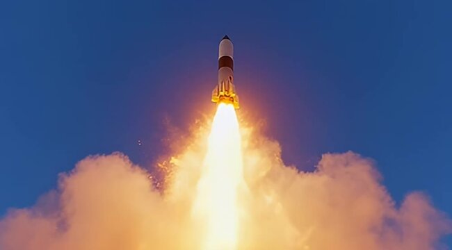 Powerful rocket blasting off into a clear blue sky with exhaust flames