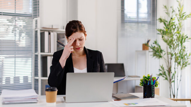 Business woman, stress and headache with headset for mistake, compliance or fail in office. Frustrated, female person or consultant agent with migraine, eye strain or difficult customer in workplace