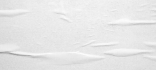 white crumpled and creased glued wrinkled paper poster texture background
