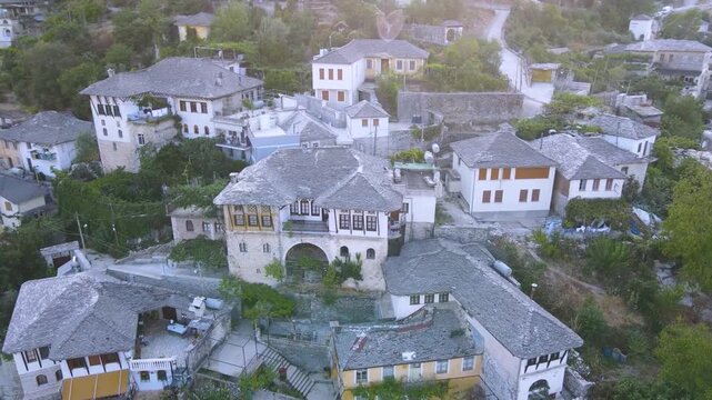 Top Down View of Gjirokast&euml;r&rsquo;s Cobblestone Street.  A vertical aerial view capturing the patterned cobblestone street of Gjirokast&euml;r framed by traditional stone rooftops. The geometric design and hist