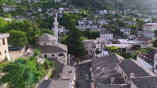 Top Down View of Gjirokast&euml;r&rsquo;s Cobblestone Street.  A vertical aerial view capturing the patterned cobblestone street of Gjirokast&euml;r framed by traditional stone rooftops. The geometric design and hist