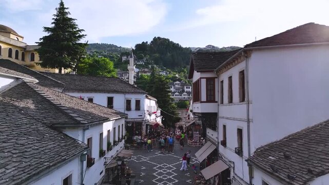 Top Down View of Gjirokast&euml;r&rsquo;s Cobblestone Street.  A vertical aerial view capturing the patterned cobblestone street of Gjirokast&euml;r framed by traditional stone rooftops. The geometric design and hist