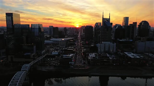 Aerial Hyperlapse Of Cars Driving On City Streets In Downtown Nashville During Sunset In Tennessee, USA.