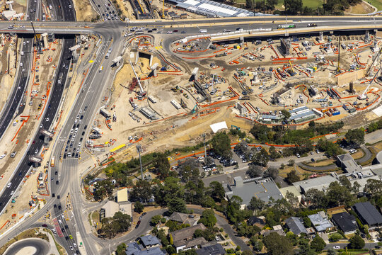 Aerial view of a bustling interchange in Bulleen, where roads converge amidst construction, creating a landscape of movement and change, Bulleen, Victoria, Australia.