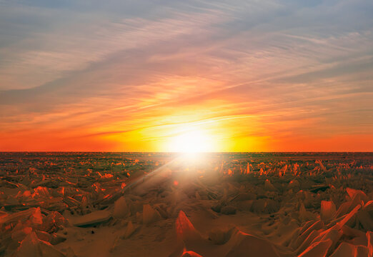 Beautiful winter landscape of frozen Lake Baikal at sunrise - Snowy ice hummocks with transparent blue piles of ice - Lake Baikal, Irkutsk region, Russia