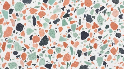 A colorful terrazzo pattern with orange, green, and black stones