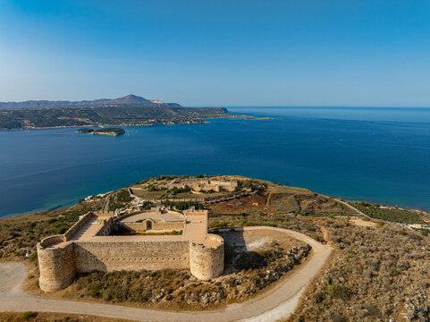 Aerial view of the imposing Forteza of Rethymno stands guard, its stone walls contrasting against the turquoise sea, Chania, Chania, Greece.