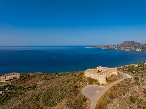 Aerial view of the imposing Fortress of Intzedin, a beacon of history against the azure sea, its stone walls whispering tales of time, Chania, Chania, Greece.