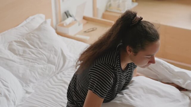 Tearful awakening scene. Woman life recovery moment. Gentle morning scene of emotional recovery. Emotional woman resting in bed as morning light softly illuminates her vulnerable face