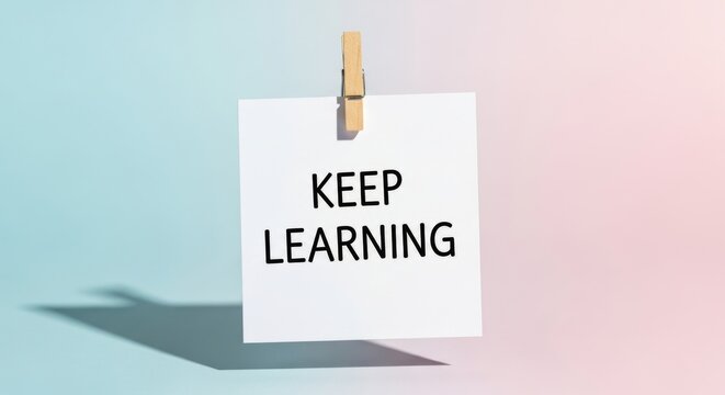 Keep Learning Message on Note with Clip, Education and Growth Concept