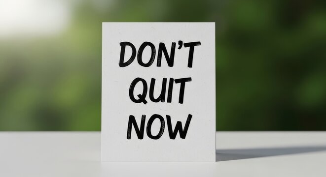 Motivational Quote Card Reads Dont Quit Now, Blurred Green Background