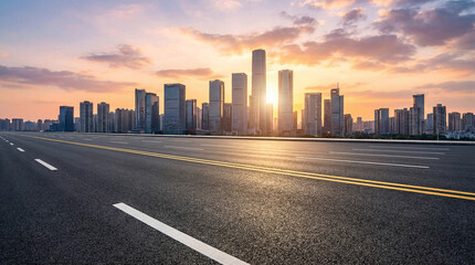 Fototapeta premium City skyline with a sun setting in the background. The sun is low on the horizon, casting a warm glow over the buildings