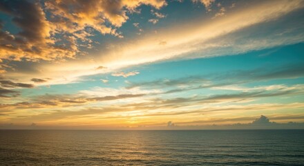 Vivid sunset painting the sky above a calm ocean with dynamic hues