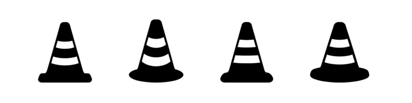 Four black traffic cones with white stripes arranged in a row on a white background