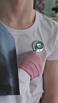 Health check with stethoscope and X-ray in a medical setting during daytime in a clinic