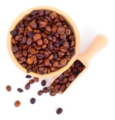 Fototapeta premium Roasted coffee beans in wooden bowl and scoop isolated on white background